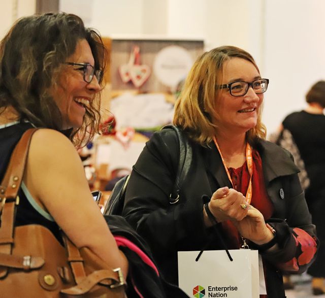 Tracey and I laughing as we chat to an exhibitor